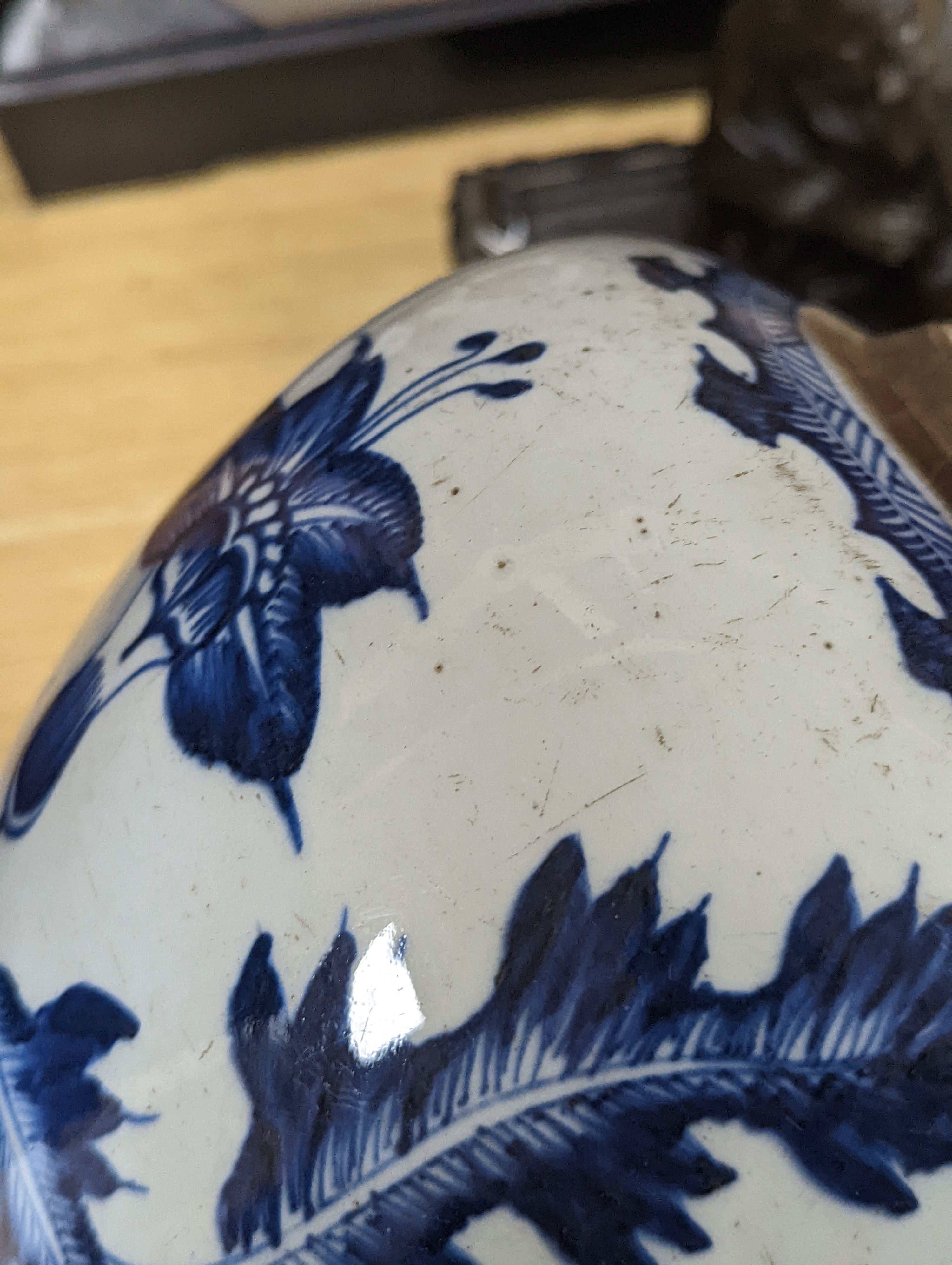 A 18th/19th century Chinese blue and white jar and wood cover - 22cm high